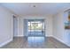 Living room with tile floors and view of the pool and patio at 13541 Stacey Dr, Hudson, FL 34667