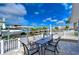 Outdoor patio with table and chairs overlooking the canal at 13541 Stacey Dr, Hudson, FL 34667