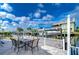 Outdoor patio area with seating and canal view at 13541 Stacey Dr, Hudson, FL 34667