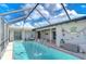 Lovely screened pool with fountain and fun decor at 13541 Stacey Dr, Hudson, FL 34667