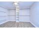 Large walk-in closet with shelving and hanging rods at 13541 Stacey Dr, Hudson, FL 34667