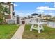 Small backyard with a picnic table and partial water view at 13822 Judy Ave, Hudson, FL 34667