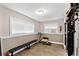 Basement home gym with a treadmill and weight training equipment at 13822 Judy Ave, Hudson, FL 34667