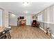 Finished basement recreation area with game setup and comfortable seating at 13822 Judy Ave, Hudson, FL 34667