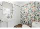 Clean bathroom with pedestal sink, shower/tub combo, and nautical decor at 13822 Judy Ave, Hudson, FL 34667