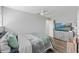 Second bedroom with a queen bed and built-in media console at 13822 Judy Ave, Hudson, FL 34667