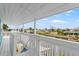 White deck overlooking the water with scenic views at 13822 Judy Ave, Hudson, FL 34667