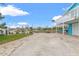 Spacious driveway with a view of the canal and neighborhood at 13822 Judy Ave, Hudson, FL 34667