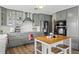 Modern kitchen with gray cabinets, stainless steel appliances, and an island at 13822 Judy Ave, Hudson, FL 34667