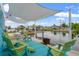 Enjoy this waterfront patio with multiple seating areas and fire pit at 13822 Judy Ave, Hudson, FL 34667