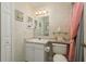 Clean bathroom with updated vanity and shower at 14120 Whitecap Ave, Hudson, FL 34667