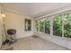 Covered patio with grill and tiled floor at 14120 Whitecap Ave, Hudson, FL 34667