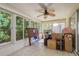 Bright Florida room with ceiling fan and sliding glass doors at 14120 Whitecap Ave, Hudson, FL 34667