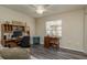Bright home office features built-in shelving and wood desk at 14120 Whitecap Ave, Hudson, FL 34667