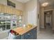 Kitchen nook with butcher block island and access to hallway at 14120 Whitecap Ave, Hudson, FL 34667