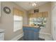 Kitchen nook with butcher block island and window seat at 14120 Whitecap Ave, Hudson, FL 34667