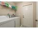 Laundry room with washer, dryer and shelving at 14120 Whitecap Ave, Hudson, FL 34667
