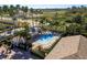 Community pool with lounge chairs and a covered patio area at 14120 Whitecap Ave, Hudson, FL 34667