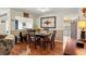 Cozy dining area with a wood table and chairs, adjacent to the living room at 2175 Pebble Beach Dr, Spring Hill, FL 34606