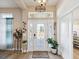 Bright and airy entryway with stained glass door and decorative accents at 3277 Ponytail Ct, Spring Hill, FL 34609