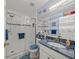 Elegant bathroom with a granite countertop and walk-in shower at 3340 Oleander Dr, Hernando Beach, FL 34607