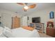 Cozy bedroom with a queen-size bed and bookshelf at 3340 Oleander Dr, Hernando Beach, FL 34607