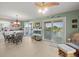 Bright dining area showcasing a fireplace and water views at 3340 Oleander Dr, Hernando Beach, FL 34607