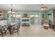 Waterfront dining area with a glass table and wicker chairs at 3340 Oleander Dr, Hernando Beach, FL 34607