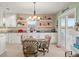 Bright eat-in kitchen with white cabinets, granite counters, and water views at 3340 Oleander Dr, Hernando Beach, FL 34607