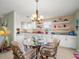 Bright eat-in kitchen with white cabinets, granite counters, and water views at 3340 Oleander Dr, Hernando Beach, FL 34607