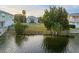 Empty waterfront lot with mature landscaping and canal views at 3340 Oleander Dr, Hernando Beach, FL 34607