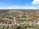 Aerial view of a neighborhood with houses and open space at 3470 Cedar Crest Loop, Spring Hill, FL 34609