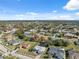 Aerial view of neighborhood featuring houses and lush landscaping at 3470 Cedar Crest Loop, Spring Hill, FL 34609