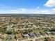 Aerial view of a neighborhood with various homes and landscaping at 3470 Cedar Crest Loop, Spring Hill, FL 34609