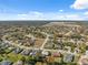 Aerial view of a residential area with a mix of homes at 3470 Cedar Crest Loop, Spring Hill, FL 34609