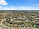 Aerial view of a residential area with houses and greenery at 3470 Cedar Crest Loop, Spring Hill, FL 34609