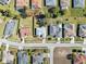 An aerial view of a neighborhood with houses and pools at 3470 Cedar Crest Loop, Spring Hill, FL 34609