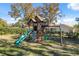 Large backyard with playset and plenty of grassy area at 3470 Cedar Crest Loop, Spring Hill, FL 34609