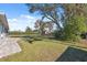 Large backyard with playground and mature trees at 3470 Cedar Crest Loop, Spring Hill, FL 34609