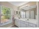 Bathroom boasts dual sinks and a large vanity at 3470 Cedar Crest Loop, Spring Hill, FL 34609