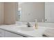 Clean bathroom vanity with a single sink and large mirror at 3470 Cedar Crest Loop, Spring Hill, FL 34609