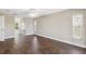 Large bedroom with dark wood-look tile flooring and plenty of closet space at 3470 Cedar Crest Loop, Spring Hill, FL 34609