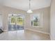 Bright dining area with sliding glass doors leading to a patio at 3470 Cedar Crest Loop, Spring Hill, FL 34609
