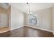 Simple dining area with hardwood flooring and a large window at 3470 Cedar Crest Loop, Spring Hill, FL 34609