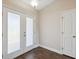 Bright entryway with double doors, hardwood floor, and a coat closet at 3470 Cedar Crest Loop, Spring Hill, FL 34609