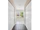 Bright hallway with tile flooring and built-in storage at 3470 Cedar Crest Loop, Spring Hill, FL 34609