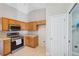 Modern kitchen features stainless steel appliances and wood cabinets at 3470 Cedar Crest Loop, Spring Hill, FL 34609