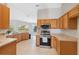 Spacious kitchen with stainless steel appliances and ample counter space at 3470 Cedar Crest Loop, Spring Hill, FL 34609