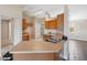 Kitchen with wood cabinets, stainless steel appliances, and a breakfast bar at 3470 Cedar Crest Loop, Spring Hill, FL 34609