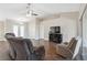 Living room with tile floors, a fireplace, and two comfortable armchairs at 3470 Cedar Crest Loop, Spring Hill, FL 34609